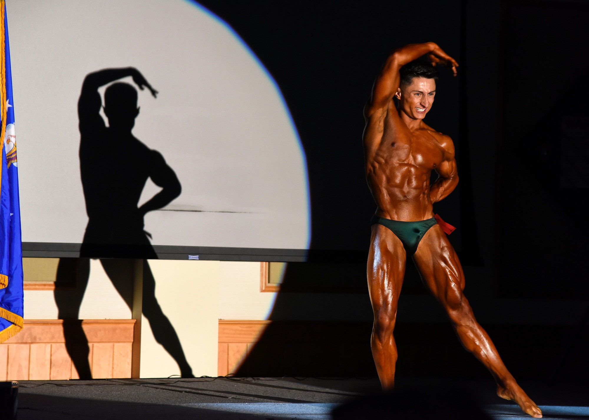 Senior Airman Christopher Almaraz, 819th RED HORSE Squadron structural journeyman, poses during a bodybuilding competition held at Malmstrom Air Force Base’s Grizzly Bend, Mont., May 8. Almaraz prepared for the competition by following a strict diet, working out three times a day and practicing his posing for ten weeks prior to the event. (U.S. Air Force photo/Airman 1st Class Collin Schmidt) 