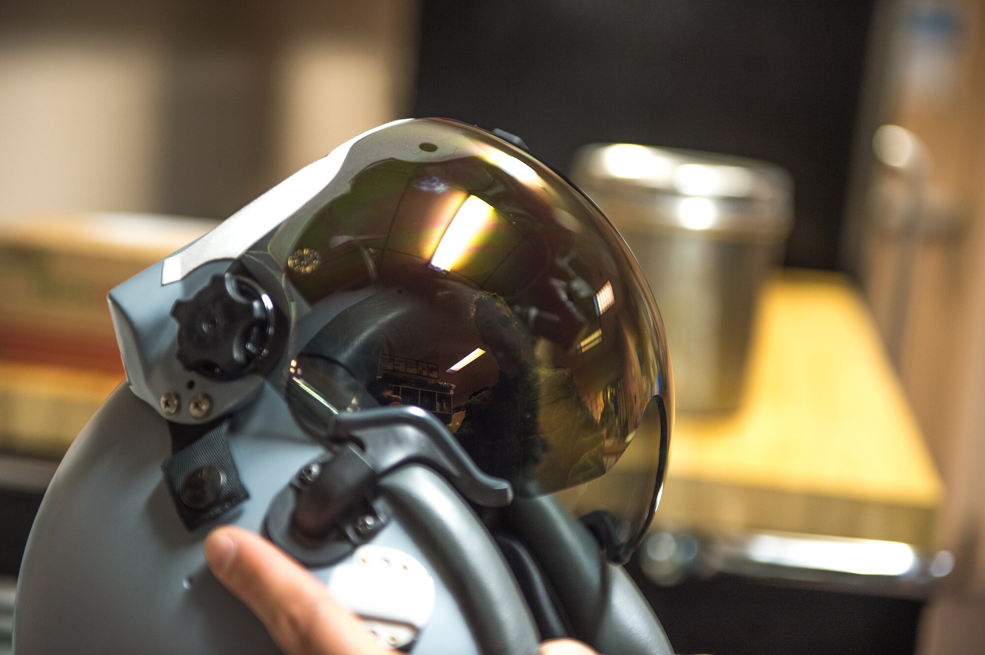 Royal Canadian air force Cpl. Yannick Deschesnes, an aircrew flight equipment technician from the 425th Tactical Fighter Squadron, tests a joint helmet-mounted cueing system for a CF-18 Hornet pilot at Eielson Air Force Base, Alaska, May 7, 2015, during RED FLAG-Alaska (RF-A) 15-2. The work completed by maintenance personnel ensures mission-capable aircraft for pilots so they can provide air support, serving a vital role in the overall RF-A mission. (U.S. Air Force photo by Staff Sgt. Shawn Nickel/Released)