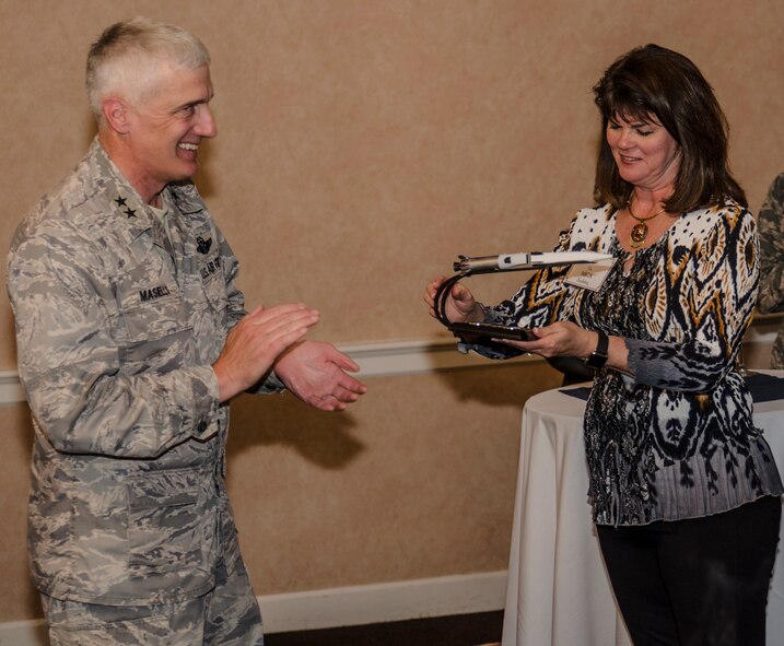 Air Force Research Laboratory commander, Maj. Gen. Tom Masiello, presents Air Force Chief Scientist, Dr. Mica Endsley, with an award featuring the X-51 hypersonic scramjet, in recognition of her many contributions to advancing Air Force technology, during a May 5 visit to AFRL at Wright-Patterson Air Force Base, Ohio. (U.S. Air Force photo by Keith Lewis)