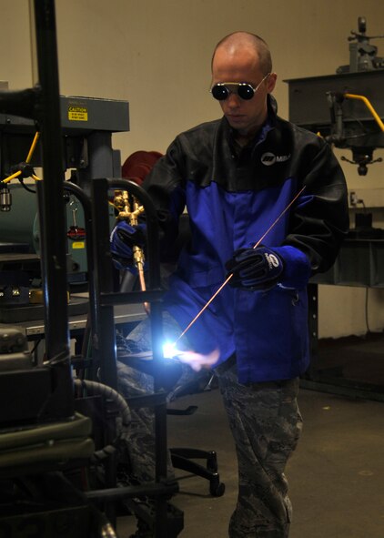 Staff Sgt. Adam Fillman, 92nd Maintenance Squadron metals technology journeyman, solders a part onto a ladder April 7, 2015, at Fairchild Air Force Base, Wash. Fillman and his flight maintain’s 35 KC-135 Stratotankers, three UH-1N Iroquois helicopters, and 493 pieces of aerospace ground equipment by operating manual/computer numerical controlled lathes, mills and precision measuring tools. He also designs and manufactures non-procurable and non-aircraft parts by utilizing technical orders or blue prints as well as weld, braze, forge, heat treat and solder metal alloys. Fillman’s leadership selected him as one of Fairchild’s Finest, a weekly recognition program that highlights top-performing Airmen. (U.S. Air Force photo/Airman 1st Class Taylor Bourgeous)
