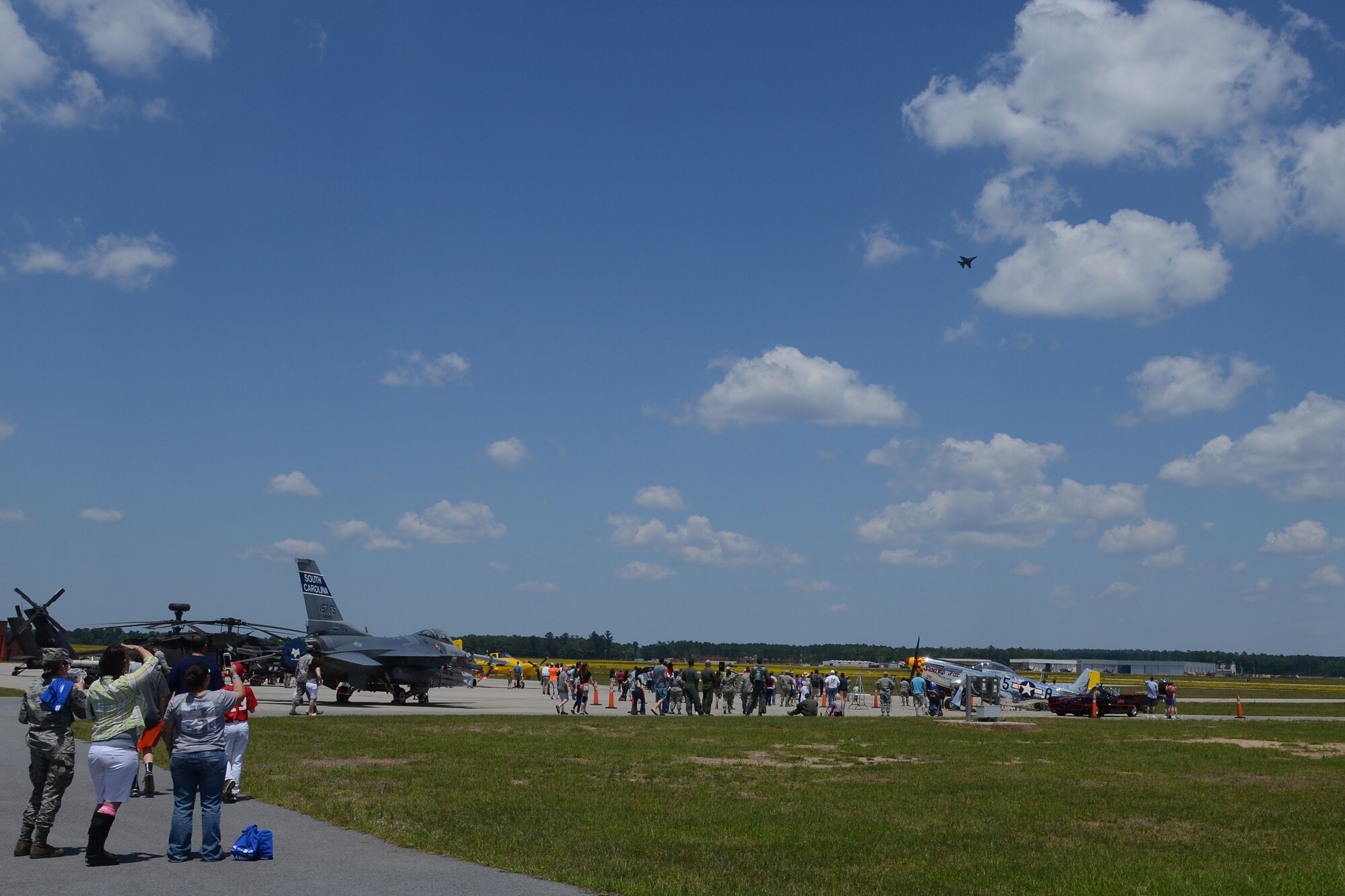 Swamp Fox Airmen and families gather for fun and fellowship during the 169th Fighter Wing Family Day at McEntire Joint National Guard Base, S.C., May 2, 2015. Local businesses and base support programs provided food and event activities to show their appreciation for the continued service of South Carolina Air National  Guard and 169th Fighter Wing families and Airmen. (U.S. Air National Guard photo by Senior Master Sgt. Edward Snyder/Released)