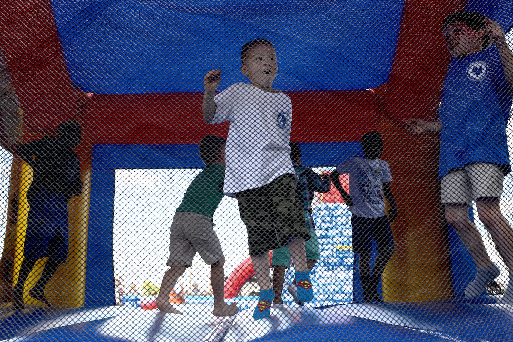 Swamp Fox Airmen and families gather for fun and fellowship during the 169th Fighter Wing Family Day at McEntire Joint National Guard Base, S.C., May 2, 2015. Local businesses and base support programs provided food and event activities to show their appreciation for the continued service of South Carolina Air National  Guard and 169th Fighter Wing families and Airmen. (U.S. Air National Guard photo by Airman 1st Class Ashleigh Pavelek/Released)