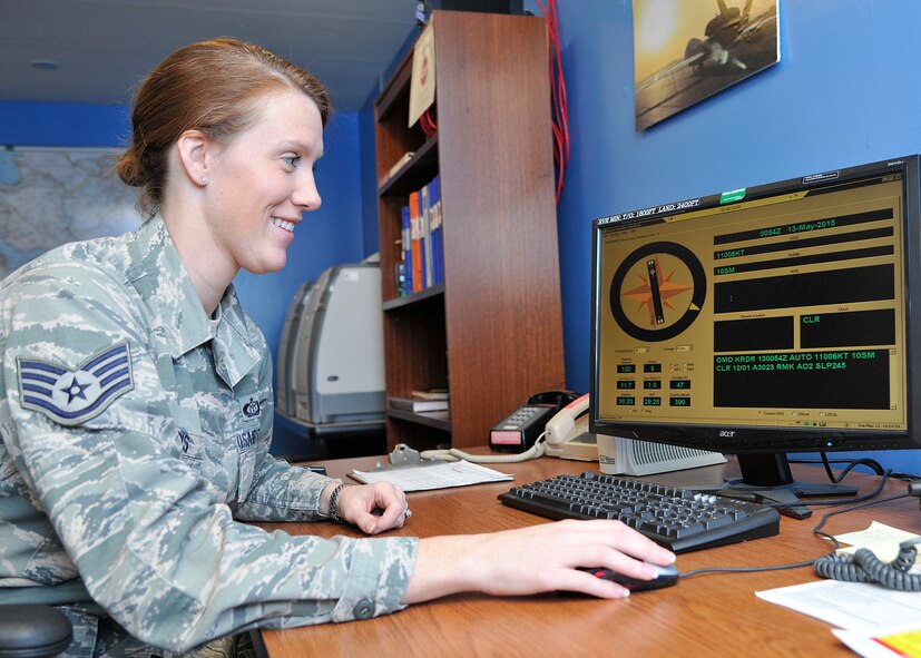 Staff Sgt. Anna Harris, 319th Operations Support Squadron weather forecaster, talks about the airfield observing system which pulls data from sensors to give present weather conditions on Grand Forks Air Force Base, N.D., May 12, 2015. Harris was selected as the Warrior of the Week for the second week of May 2015. (U.S. Air Force photo by Senior Airman Xavier Navarro/released)