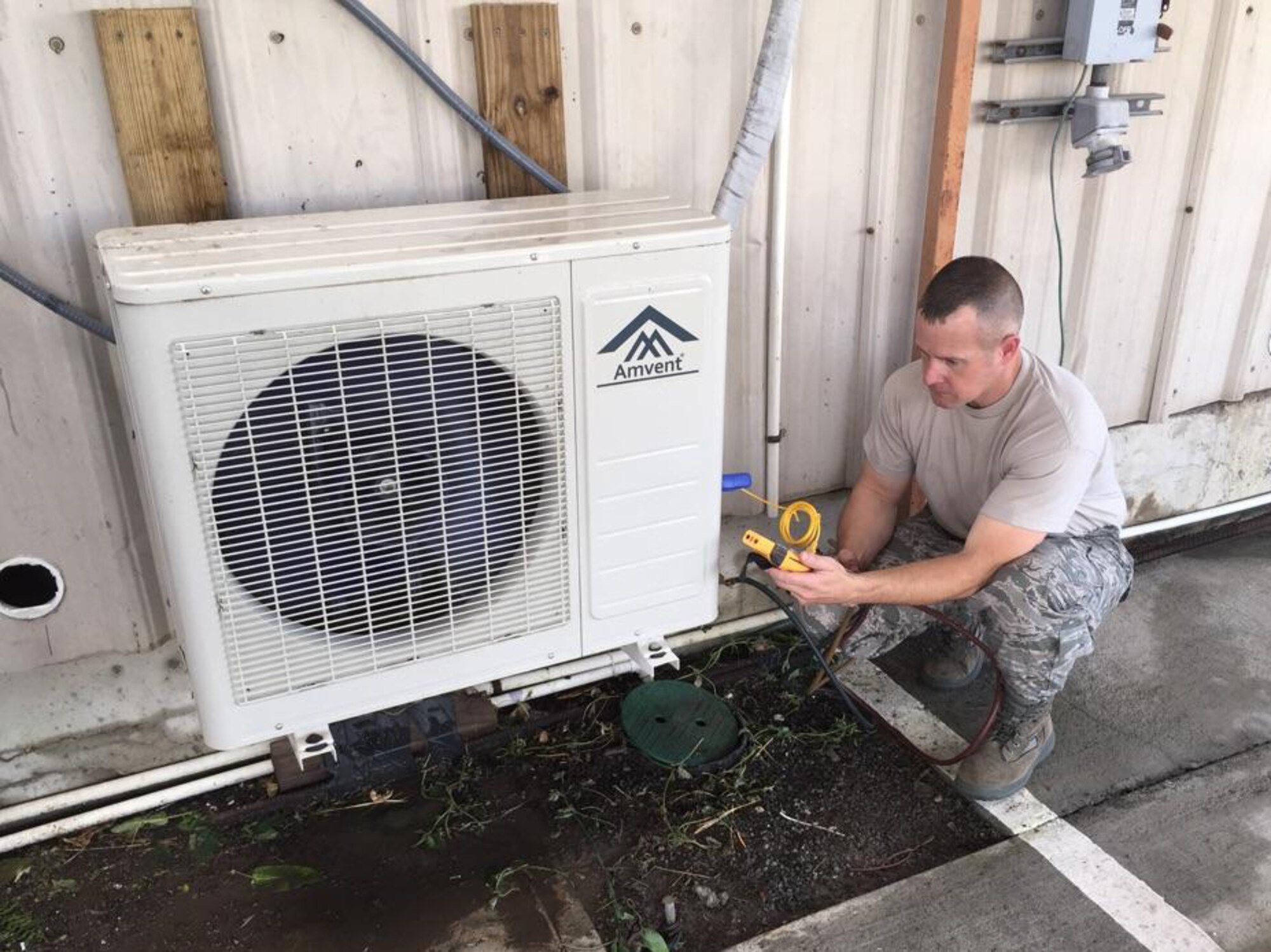 Master Sgt. Kevin Shows, 403rd Civil Engineer Squadron heating, ventilation and air conditioning craftsman, works on a condensing unit for an air conditioner May 5 at the 53rd Weather Reconnaissance Squadron “Hurricane Hunters” facilities at their forward operating location at the Henry E. Rohlsen Airport, St. Croix, U.S. Virgin Islands. This is slated to be the last storm season for the civil engineers to maintain the facility in St. Croix due to the 403rd CES scheduled inactivation Sept. 15, 2015. (Courtesy photo)