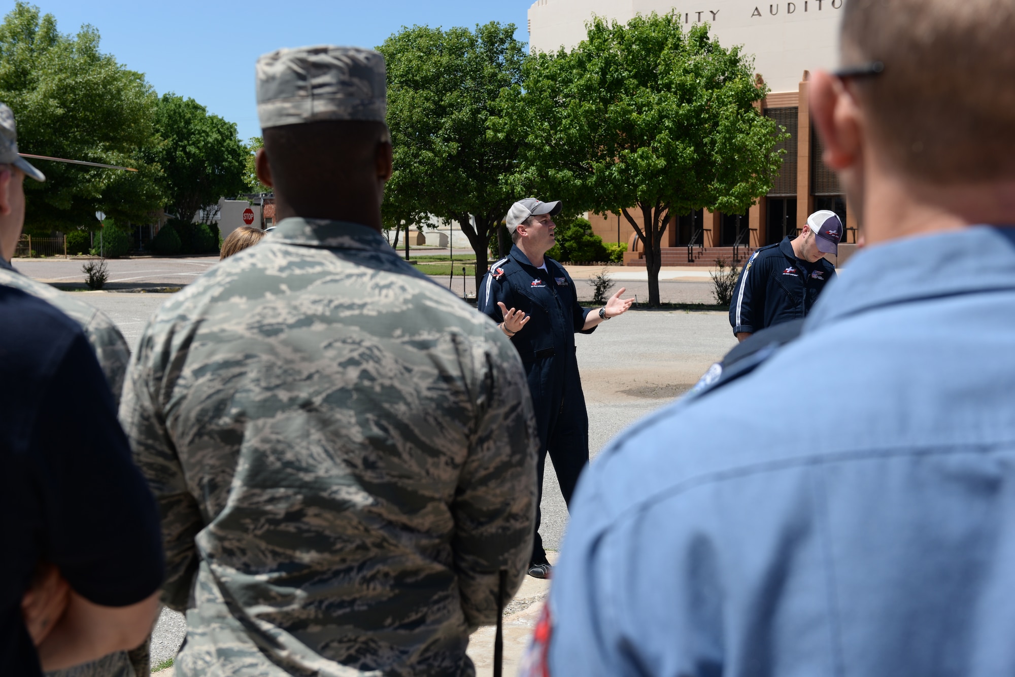 ALTUS AIR FORCE BASE, Okla. – Casey Bussett, pilot and safety officer for the Air Evac Lifeteam, speaks about how the air evacuation team works with members of the Altus police and fire departments and the Altus AFB fire department at the Altus Fire Department, May 11, 2015. These response teams hold group training several times a year to review how their efforts work together. (U.S. Air Force photo by Senior Airman J. Zuriel Lee/Released)