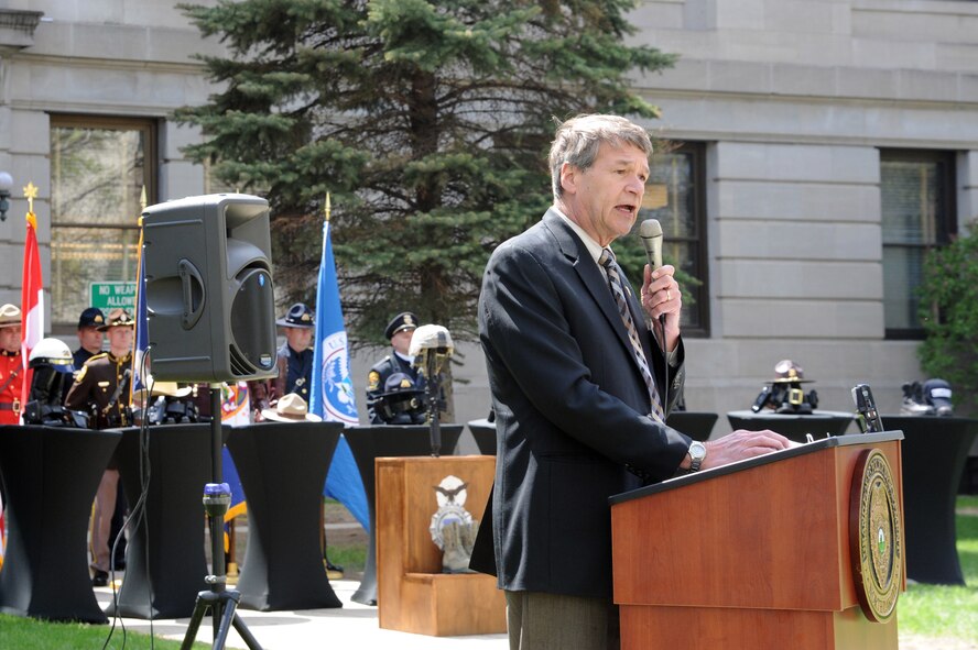 North Dakota Attorney General Wayne Stenehjem delivers the keynote address during the annual Police Week memorial ceremony in Grand Forks, N.D., May 12, 2015. The event was attended by law enforcement officers from the states of North Dakota and Minnesota, the U.S. Air Force, as well the U.S. Border Patrol and the Royal Canadian Mounted Police. (U.S. Air Force photo by Staff Sgt. David Dobrydney/released)