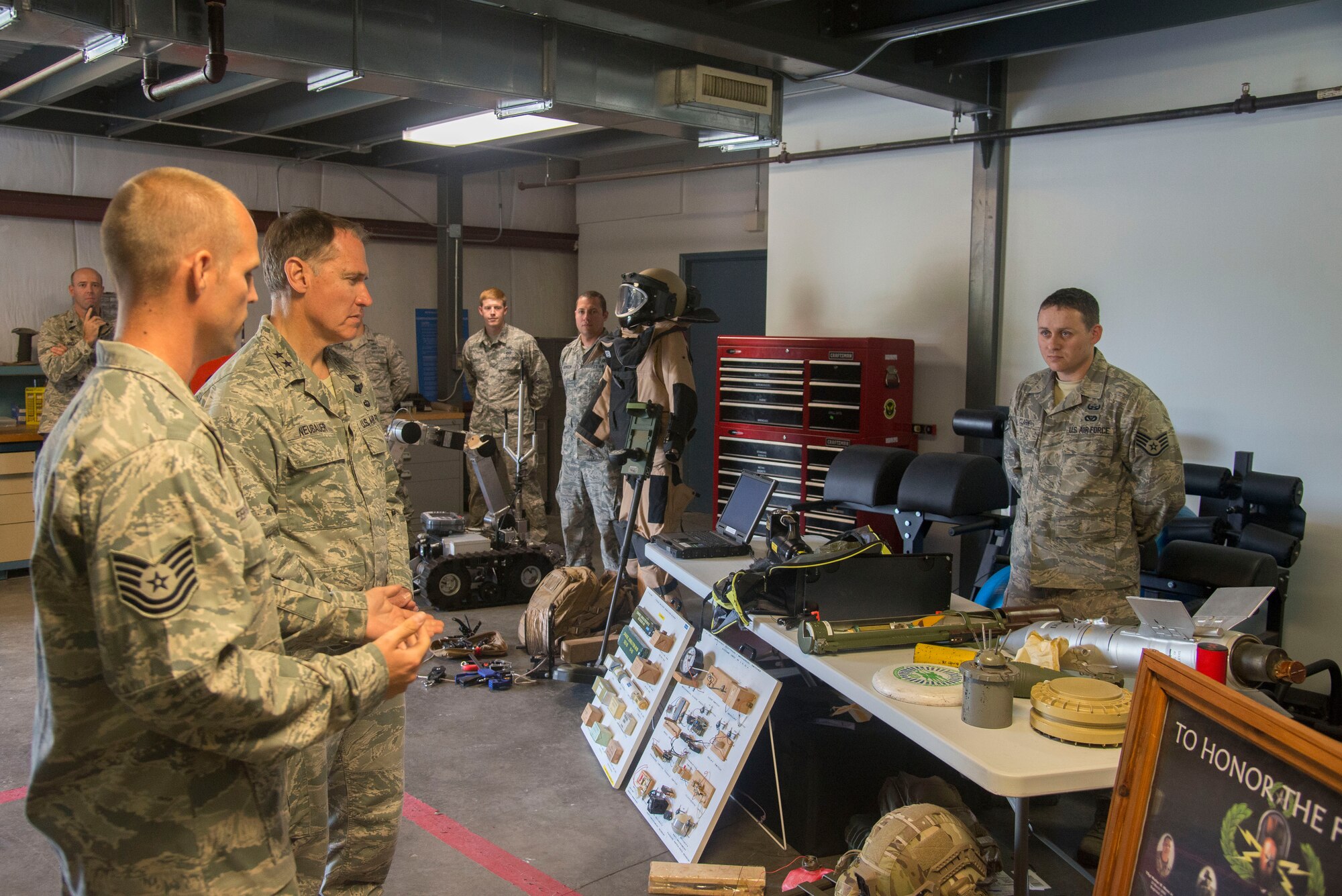 Tech. Sgt. Dwayne Ferguson, 628th Civil Engineer Squadron Explosive Ordnance Disposal  technician, details EOD operations and safety measures to Maj. Gen. Kurt Neubauer, May 6, 2015, at Joint Base Charleston, S.C. Neubauer is the Air Force Chief of Safety, Headquarters U.S. Air Force, Washington, D.C., and commander, Air Force Safety Center, Kirtland Air Force Base, N.M. He develops, executes and evaluates all Air Force aviation, ground, weapons, space and system mishap prevention, and nuclear surety programs to preserve combat readiness. In addition to touring JB Charleston, Neubauer was the guest speaker at the Charleston Metro Chamber of Commerce's State of the Region: Salute to the Military event May 7, 2015 on the USS Yorktown at Patriot’s Point in Mount Pleasant, S.C. (U.S. Air Force photo/Senior Airman George Goslin)