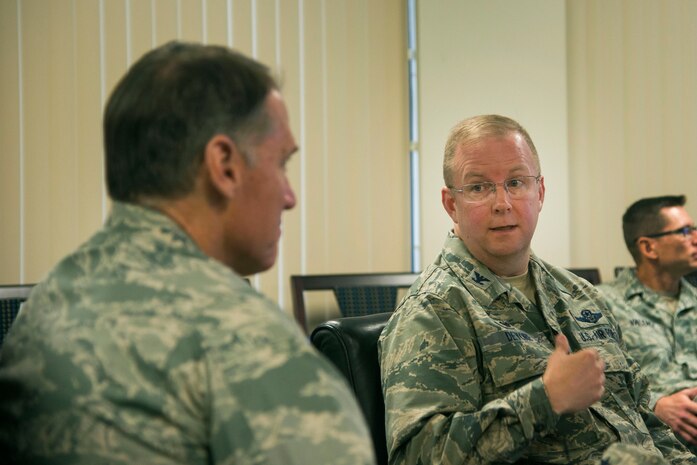 Colonel Jeffrey DeVore, Joint Base Charleston commander, briefs Maj. Gen. Kurt Neubauer on the joint base mission capabilities, May 6, 2015, at Joint Base Charleston, S.C. Neubauer is the Air Force Chief of Safety, Headquarters U.S. Air Force, Washington, D.C., and Commander, Air Force Safety Center, Kirtland Air Force Base, N.M. He develops, executes and evaluates all Air Force aviation, ground, weapons, space and system mishap prevention, and nuclear surety programs to preserve combat readiness. In addition to meeting with senior leaders, Neubauer toured the 437th Aerial Port Squadron, the 437th Maintenance Squadron’s Corrosion Control Facility, the 628th Civil Engineering Squadron’s Explosives Ordnance Disposal unit as well as a tour of the Naval Nuclear Power Training Command and a windshield tour of other vital units located on the Weapons Station property. Neubauer also served as the guest speaker at the Charleston Metro Chamber of Commerce's State of the Region: Salute to the Military event May 7, 2015 on the USS Yorktown at Patriot’s Point in Mount Pleasant, S.C. (U.S. Air Force photo/Senior Airman George Goslin)