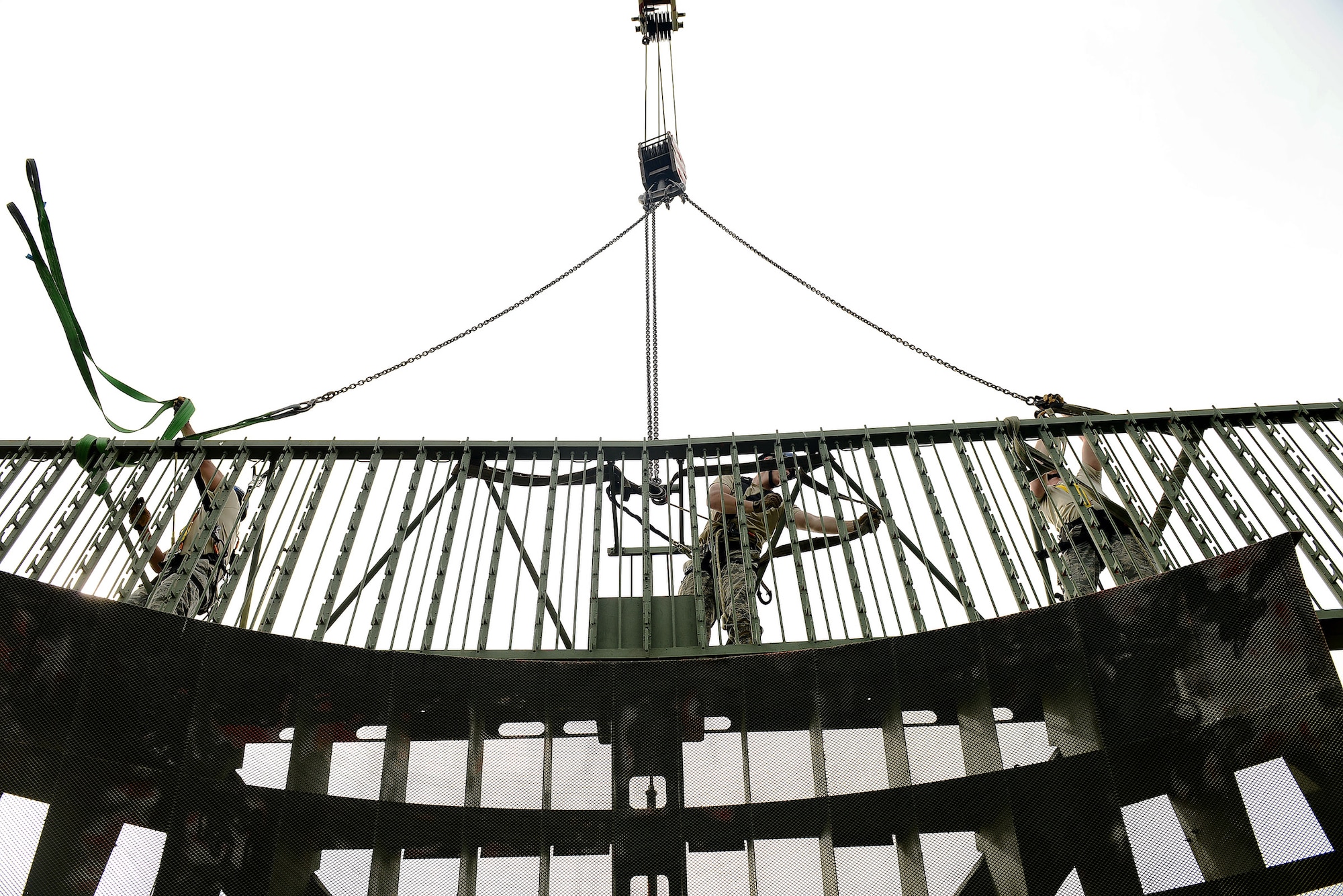 A team of radar systems technicians assigned to the Headquarters Air Force Flight Standards Agency-European Regional Maintenance Center from Kapaun Air Station, Germany, prepare to remove a Ground Pulse Navigation-20 Airport Surveillance Radar antenna, May 13, 2015, at Aviano Air Base, Italy. The team worked with the 31st Operations Support Squadron ground radar maintenance flight and the Air Force Life Cycle Management Center from Hanscom Air Force Base, Mass., to remove the decommissioned antenna from a 77-foot tower. (U.S. Air Force photo by Staff Sgt. R.J. Biermann/Released)