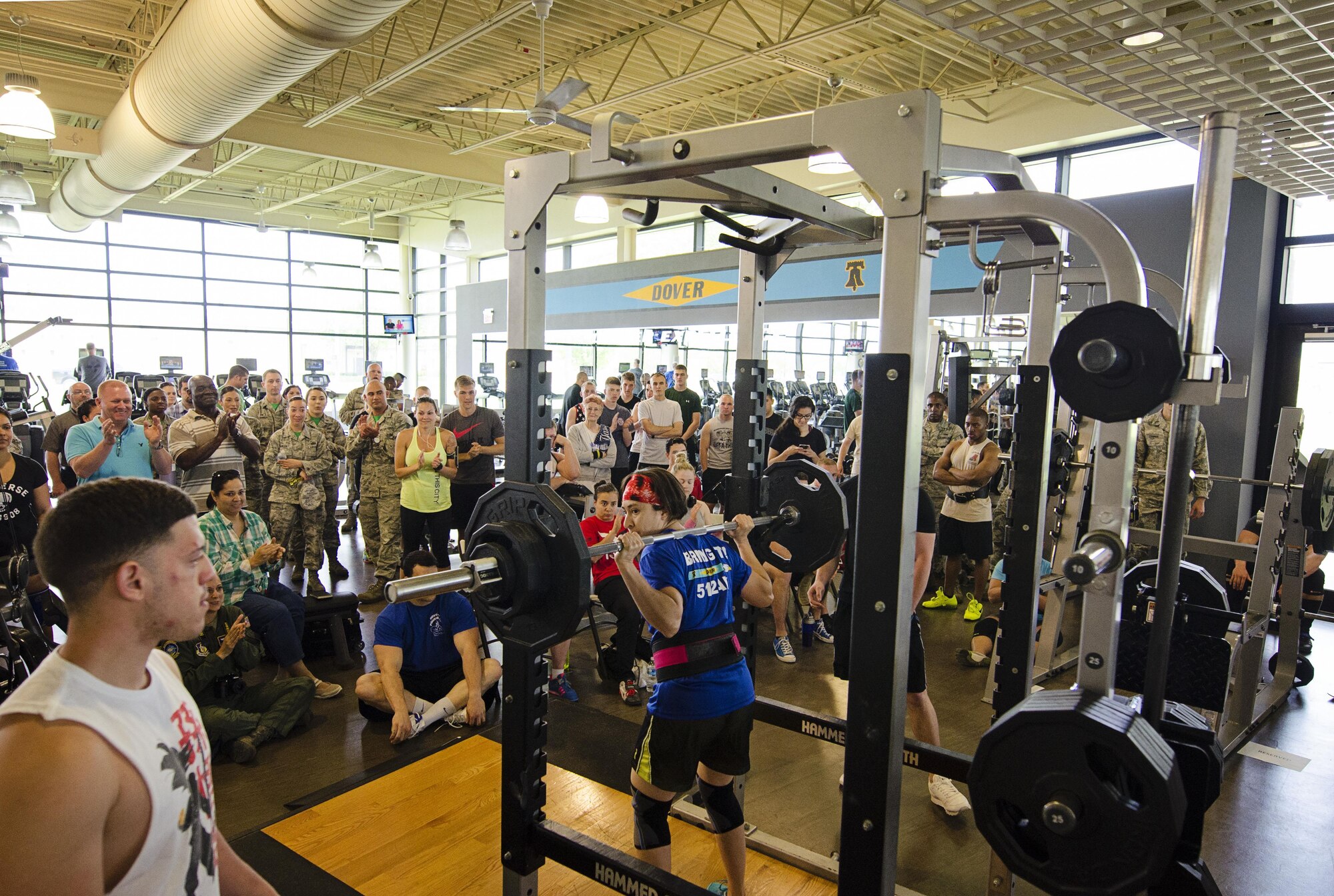 Liberty Wing reservist, Technical Sgt. Carolina Rodriquez from the 709th Airlift Squadron, racks the weights after successfully squatting 180 pounds. She along with roughly 20 competitors participated in the team dover powerlifting competition, consisting of squat, bench press and deadlift. (U.S. Air Force photo by Capt. Bernie Kale)