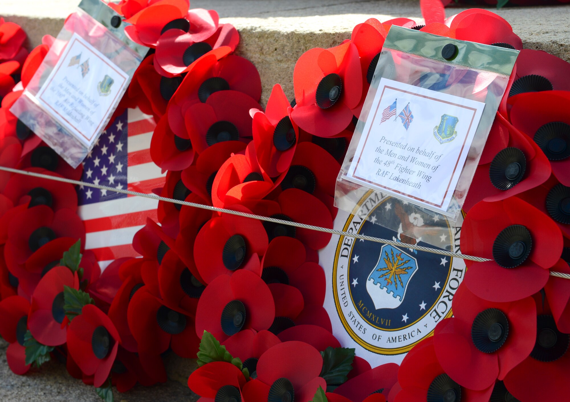 Poppy wreaths were presented by Airmen representing Royal Air Forces Lakenheath and Mildenhall at a World War II memorial in Bury St. Edmunds, England, May 9, 2015. Poppies are a significant memorial symbol to the men and women who bravely served and lost their lives in war. (U.S. Air Force photo by Airman 1st Class Dawn M. Weber/Released)