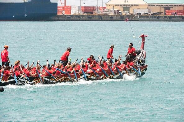 The Kadena Shoguns women’s team race paddle a dragon boat while competing in the Naha Dragon Boat Races at Naha Port, Japan, May 5, 2015. The Kadena Shogun women’s team placed 11th out of the 63 teams that competed that day. (U.S. Air Force photo by Senior Airman Omari Bernard)