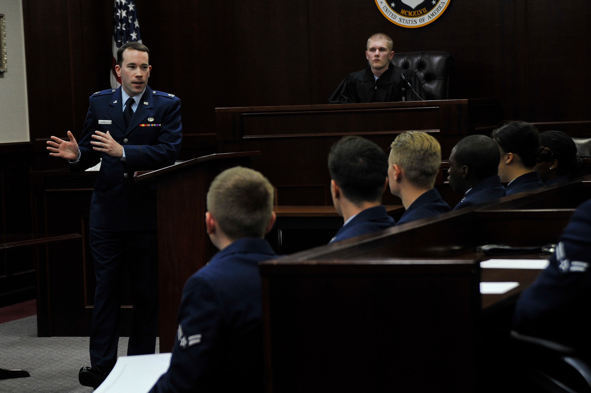 U.S. Air Force Capt. Peter Donnelly, 35th Fighter Wing assistant judge staff advocate, deliberates final comments on behalf of the prosecution during a mock sexual assault case at Misawa Air Base, Japan, April 24, 2015. The mock trials are intended to demonstrate what happens after a sexual assault report is made and to stress the responsibility every Airman has to combat and prevent sexual assault. (U.S. Air Force photo by Senior Airman Jose L. Hernandez-Domitilo/Released)