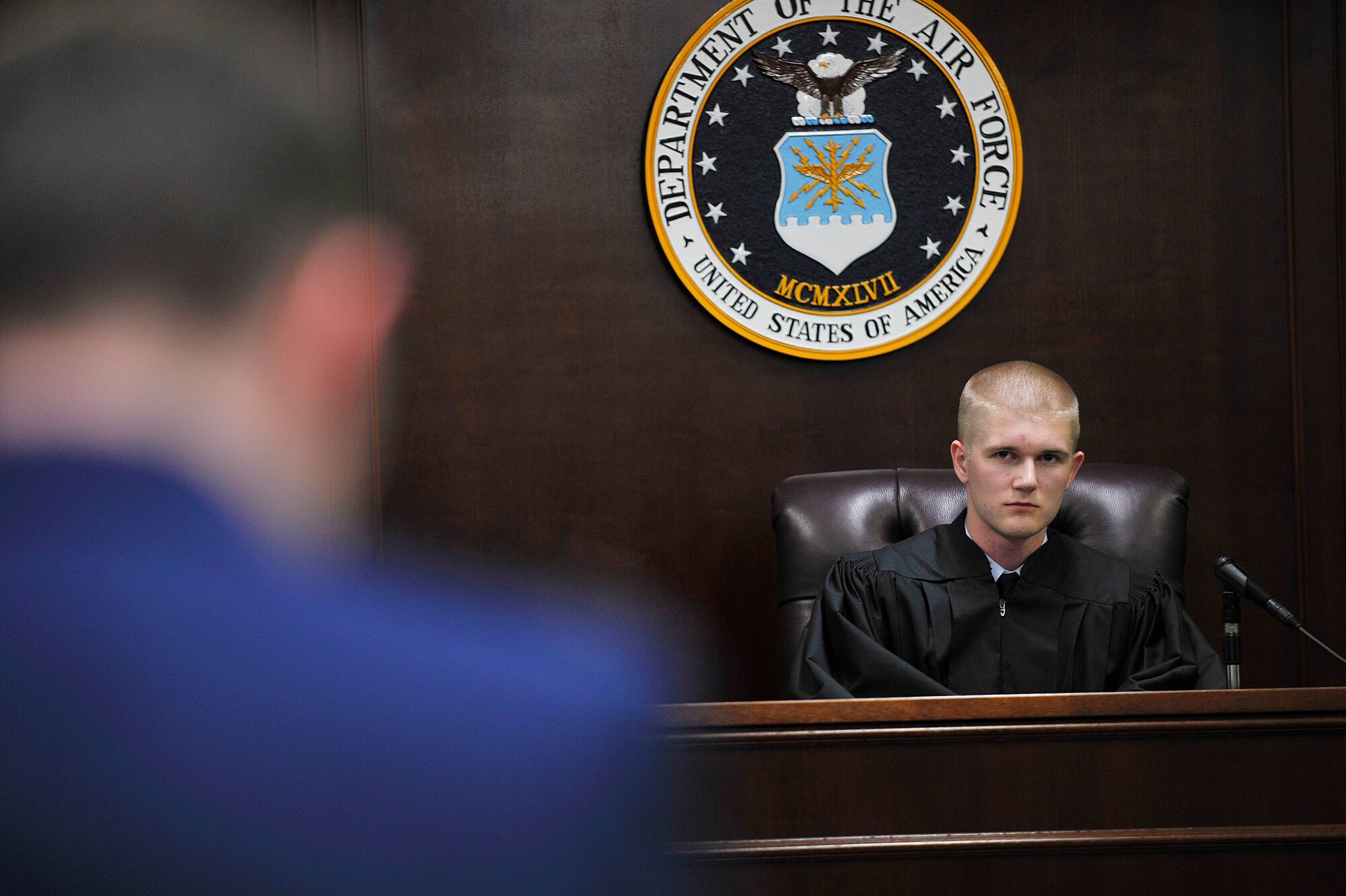 U.S. Air Force Airman 1st Class Patrick Hoerle, 35th Fighter Wing paralegal, plays the role of a judge in a mock sexual assault case at Misawa Air Force Base, Japan, April 24, 2015. This training is intended to highlight the consequences of sexual assault though a realistic portrayal of a sexual assault trial. (U.S. Air Force photo by Senior Airman Jose L. Hernandez-Domitilo/Released)