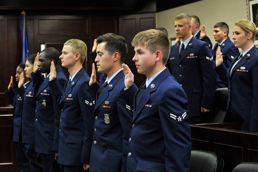 U.S. Air Force Airmen are prompted to say the jurors’ solemn oath during a mock trial at Misawa Air Force Base, Japan, April 24, 2015. These Airmen participated in the First Term Airman’s Council course which has been extended an extra day to include the mock sexual assault trial. (U.S. Air Force photo by Senior Airman Jose L. Hernandez-Domitilo/Released)