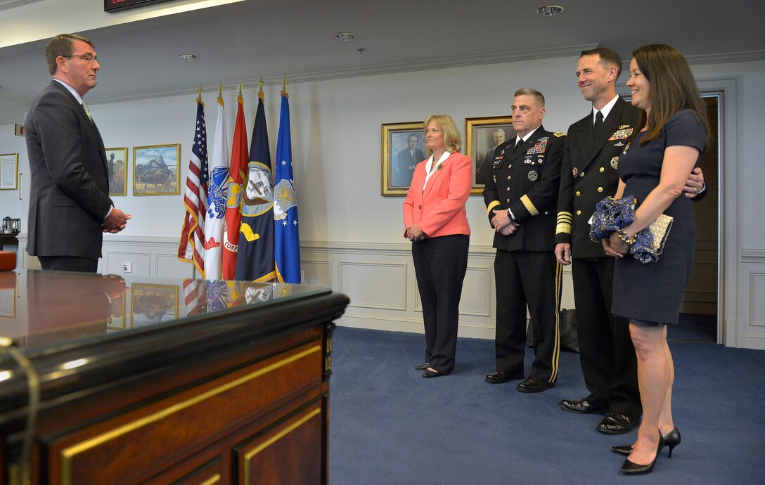 Defense Secretary Ash Carter meets with Navy Adm. John M. Richardson, right, and Army Gen. Mark A. Milley in his office before a press briefing at the Pentagon, May 13, 2015. Milley's wife, Hollyanne, and Richardson's wife, Dana, participated in the meeting.
