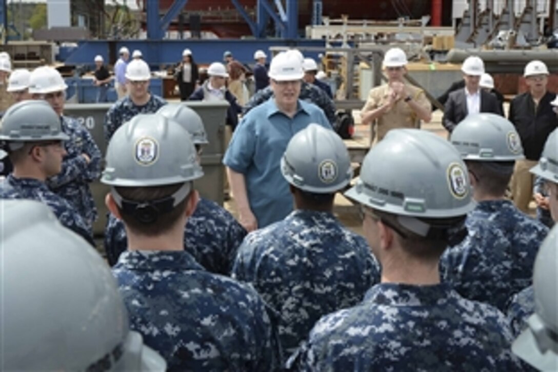 Deputy Defense Secretary Bob Work speaks with crew members assigned to Pre-Commissioning Unit Zumwalt during a visit to Bath Iron Works in Bath, Maine, May 12, 2015.  