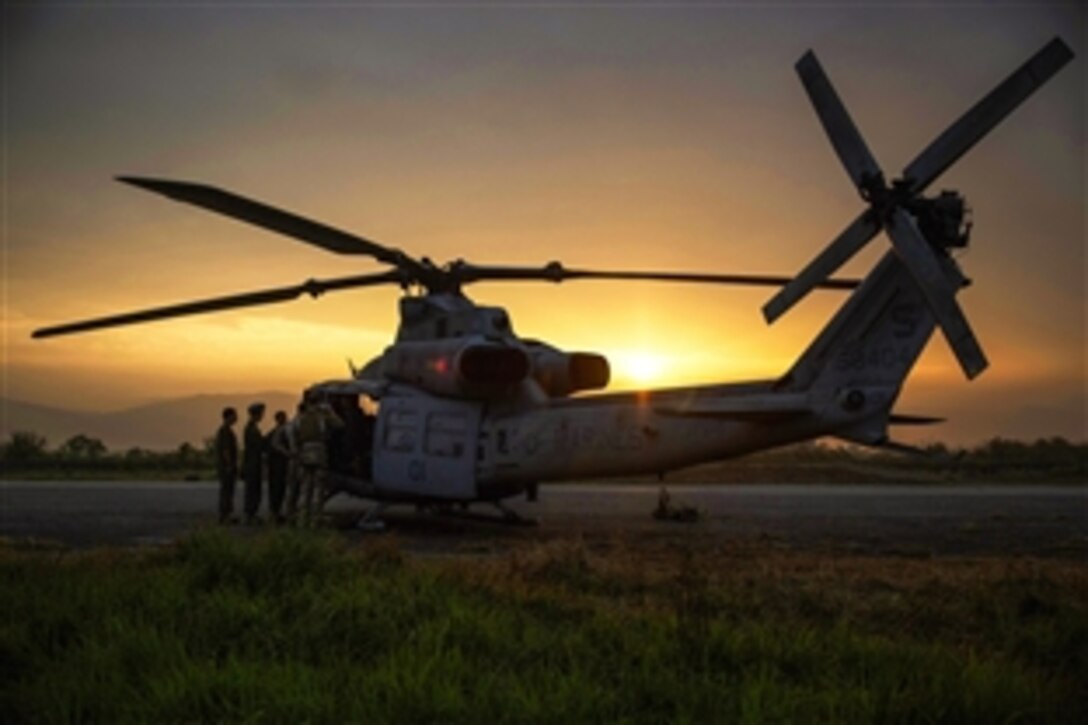 U.S. Marines prepare a UH-1Y Huey helicopter to begin a search and rescue mission from the Tribhuvan International Airport in Kathmandu, Nepal, May 13, 2015. A UH-1Y Huey assigned to Marine Light Attack Helicopter Squadron 469, carrying six Marines and two Nepalese soldiers, went missing while conducting humanitarian assistance after a magnitude-7.3 aftershock. 
