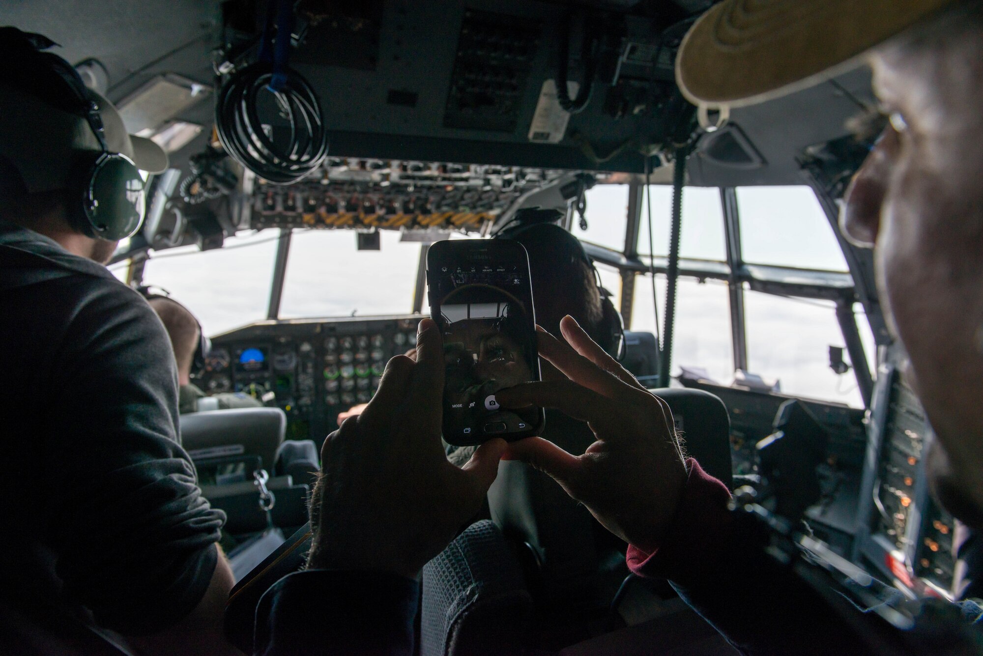 Air Traffic Controllers from Minneapolis-St. Paul fly get a view from the cockpit of a 934th Airlift Wing C-130 during a familiarization flight May 6. (Air Force Photo/Staff Sgt. Trevor Saylor)

