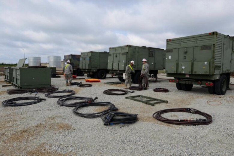 Members of the U.S. Army Corps of Engineers 249th Engineer Battalion, from Fort Belvoir, Va., work to hook up generators at Naval Support Facility Deveselu, Romania, April 18, 2015.