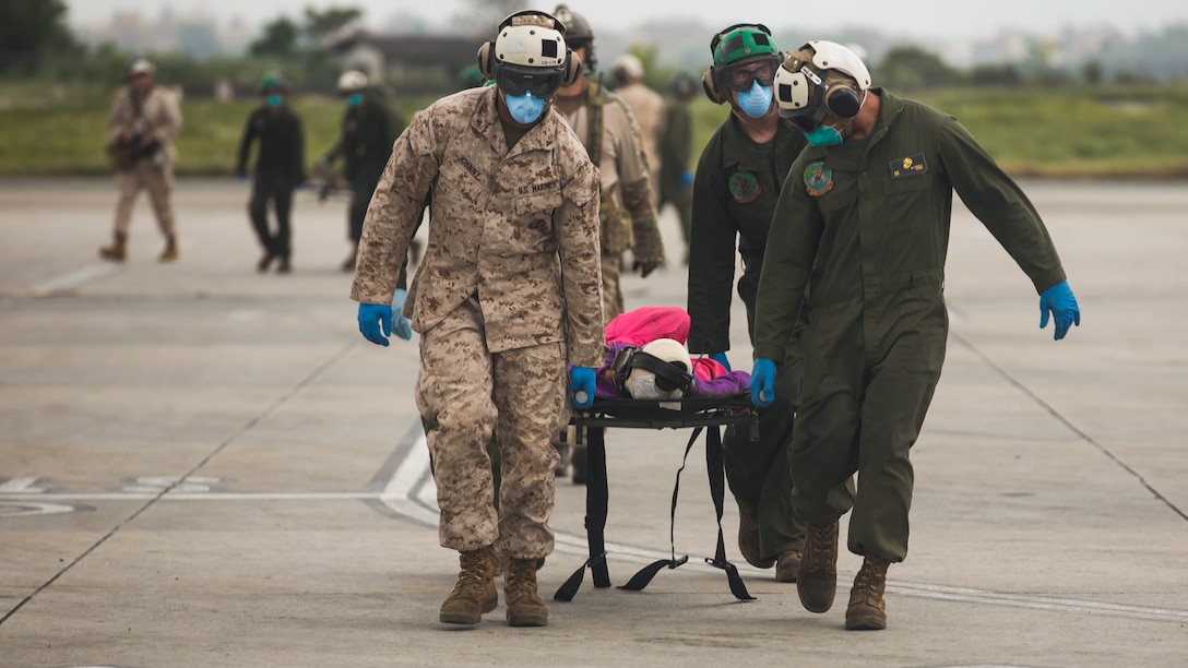 U.S. Service members with Joint Task Force 505, carry an earthquake victim to a medical triage area at Tribhuvan International Airport, Kathmandu, Nepal, May 13, after a 7.3 magnitude earthquake struck the country. JTF 505 along with other multinational forces and humanitarian relief organizations are currently in Nepal providing aid after a 7.8 magnitude earthquake struck the country, April 25, and now the most recent 7.3 earthquake on May 12. At Nepal’s request the U.S. government ordered JTF 505 to provide unique capabilities to assist Nepal. 