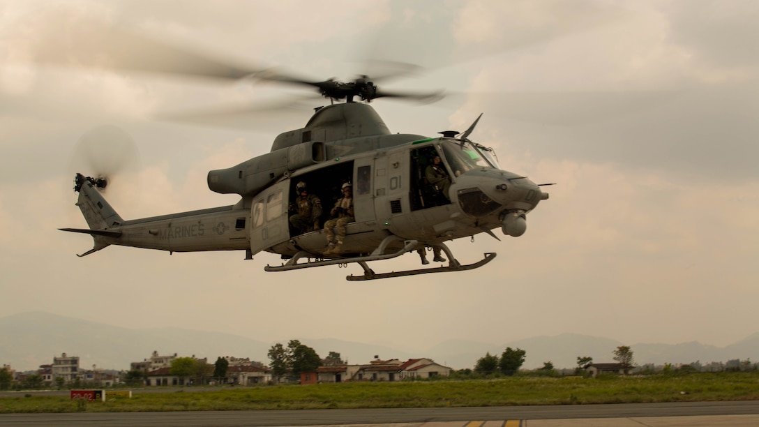 A UH-1Y Huey helicopter flies into the Tribhuvan International Airport in Kathmandu, Nepal, after a search and rescue operation May 13. A UH-1Y Huey assigned to Marine Light Attack Helicopter Squadron 469, carrying six Marines and two Nepalese soldiers, went missing while conducting humanitarian assistance after a 7.3 magnitude earthquake May 12. The Marines with HMLA-469, currently part of Joint Task Force 505 participating in operation Sahayogi Haat, responded in support of the government of Nepal after a 7.8 magnitude earthquake struck the country April 25. 