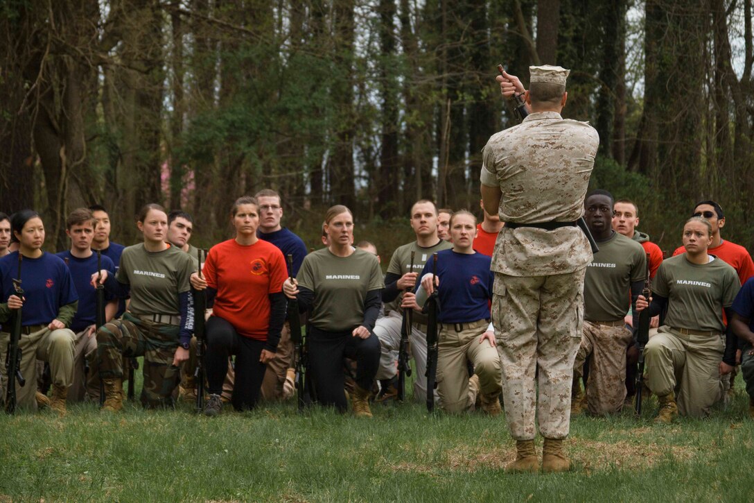 U.S. Marine Corps Gunnery Sgt. Dale Barbitta, a drill instructor assigned to the United States Naval Academy, instructs officer candidates in the manual of arms with a M16A2 service rifle during a training exercise at the Naval Support Activity Annapolis, Maryland, April 25, 2015. The exercise was designed to prepare officer candidates from Recruiting Stations Baltimore and Frederick for the physical and mental challenges of Marine Corps Officer Candidate School. OCS trains, screens and evaluates candidates, who must demonstrate a high level of leadership potential and commitment to success in order to earn a commission as an officer in the United States Marine Corps. (U.S. Marine Corps photo by Sgt. Bryan Nygaard/Released)