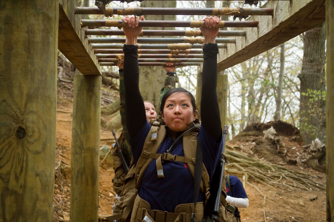 U.S. Marine Corps officer candidates negotiate obstacles during a training exercise at the Naval Support Activity Annapolis, Maryland, April 25, 2015. The exercise was designed to prepare officer candidates from Recruiting Stations Baltimore and Frederick for the physical and mental challenges of Marine Corps Officer Candidate School. OCS trains, screens and evaluates candidates, who must demonstrate a high level of leadership potential and commitment to success in order to earn a commission as an officer in the United States Marine Corps. (U.S. Marine Corps photo by Sgt. Bryan Nygaard/Released)