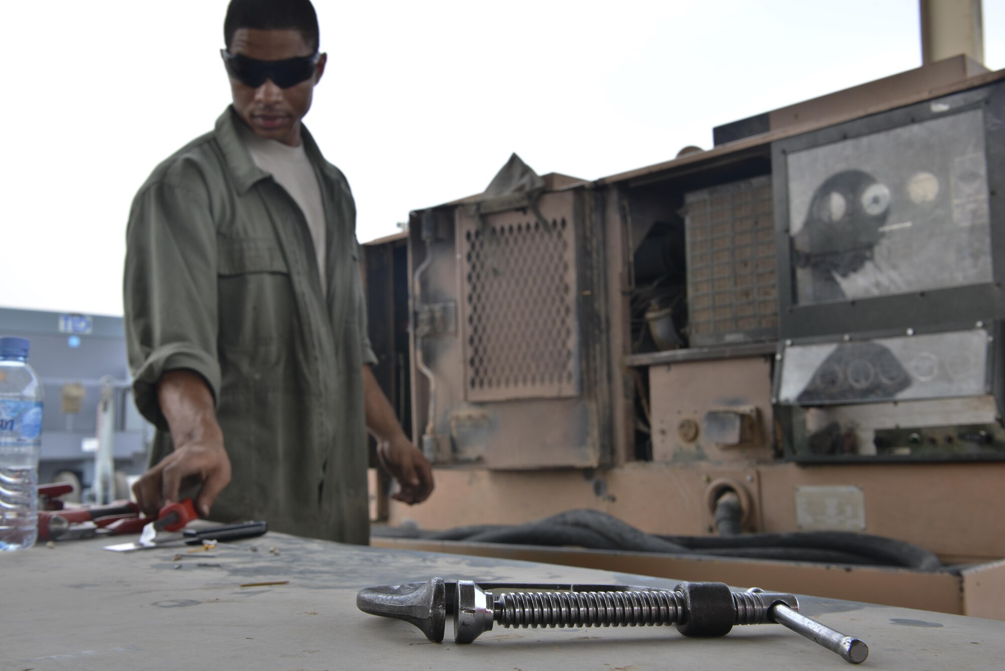 Aerospace Ground Equipment airmen from the 379th Expeditionary Maintenance Squadron conduct 24-hour routine aircraft support equipment inspections and repairs with various sets of tools which they must be qualified to use prior to completing their daily tasks at Al Udeid Air Base, Qatar. (U.S. Air Force photo by Staff Sgt. Alexandre Montes)  