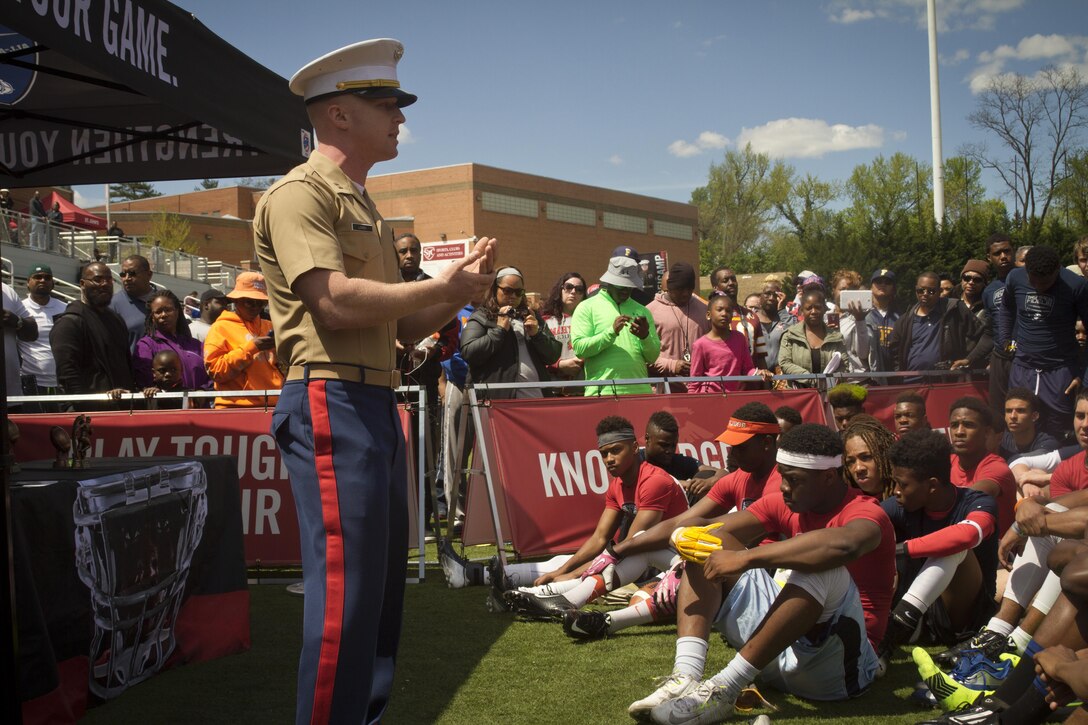 Marine Corps Capt. Matthew Lowen talks to high school athletes about leadership during the Marine Corps’ Semper Fidelis All-American Football Camp, which was held at St. John’s College High School in Washington DC on April 26, 2015.  The Semper Fidelis All-American Football Camp allowed student athletes to hone their football skills while receiving instruction from high school, college and NFL Players Association Coaches. In addition, these students had the distinct opportunity of receiving discipline, leadership and character skills from United States Marines. (US Marine Corps photo by Sgt. Bryan Nygaard/Released)
