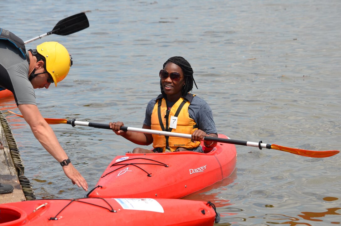 A kayak race participant paddles to the dock after her lap in the kayak relay race that took place during Potomac River Festival on Saturday. Teams of three raced around a course marked out in the Potomac.
