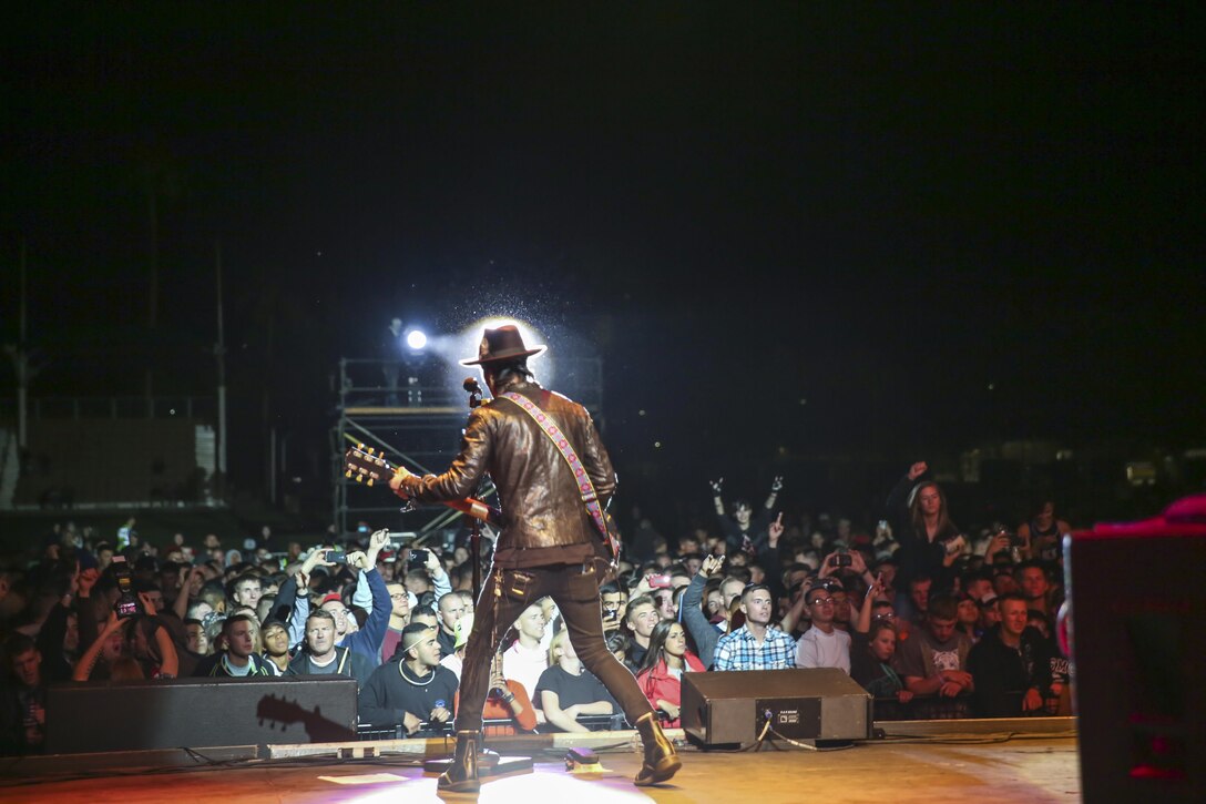 Stevie D, guitarist, Buckcherry, performs during the ‘We Salute You Fest’ at Lance Cpl. Torrey L. Gray Field, May 8, 2015. The band Adelitas Way opened the concert for Buckcherry’s performance.   (Official Marine Corps photo by Pfc. Levi Schultz/Released)
