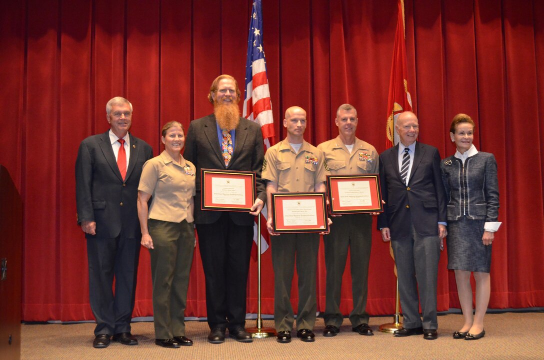 On May 8, Marine Corps University held the Rose Award ceremony, which recognizes outstanding educators in the Marine Corps community. Each recipient receives a certificate for teaching excellence and a financial award. From left are Dr. Jerre Wilson, vice president for Academic Affairs at MCU; Brig. Gen. Helen Pratt, MCU president; Michael Lewis, Command and Staff College professor and civilian award recipient; Staff Sgt. John Witt, instructor from Marine Corps Base Twentynine Palms, California and enlisted award recipient; Lt. Col. David Bardorf, CSC professor and officer recipient; and Dr. Elihu Rose and Susan Rose, the award sponsors.