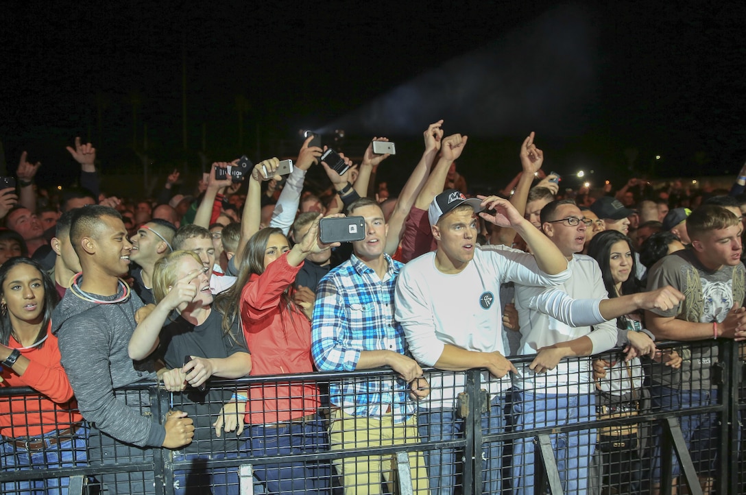 Combat Center patrons cheer for rock band, Buckcherry, during the ‘We Salute You Fest’ music celebration at Lance Cpl. Torrey L. Gray Field, May 8, 2015. The event featured live performances from rock bands Buckcherry and Adelitas Way, on May 8, and country music singers Rodney Atkins and Caroline Kole on May 9. (Official Marine Corps photo by Pfc. Levi Schultz/Released)