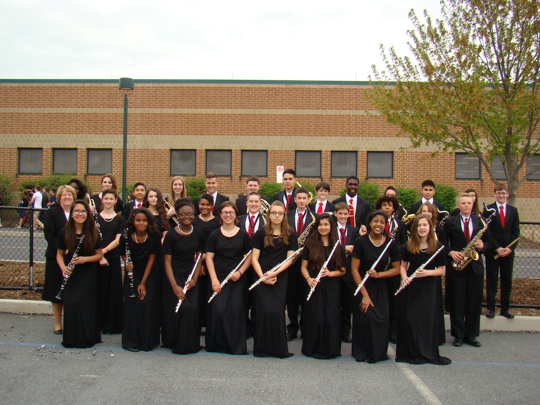 The Quantico Middle/High School advanced band poses for a group shot in their formal attire before departing for Hershey, Pennsylvania, and the Music in the Parks festival held May 2. The band earned first place in their division. 