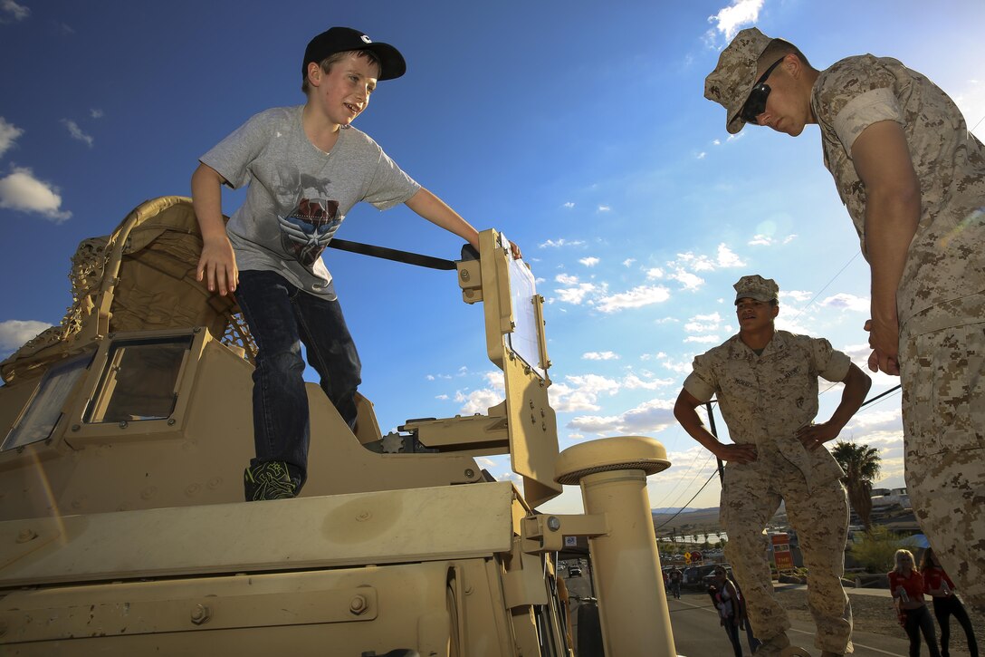 John Foley Jr., 10, son of John Foley, a Yucca Valley native, gets a tour of Marine Corps vehicles set up as static displays during the Family Fun Day event as part of the ‘We Salute You Fest’ music celebration at Lance Cpl. Torrey L. Gray Field, May 9, 2015. Other attractions included a car show and live performances by rock band Buckcherry and country music artist Rodney Atkins. (Official Marine Corps photo by Pfc. Levi Schultz/Released)