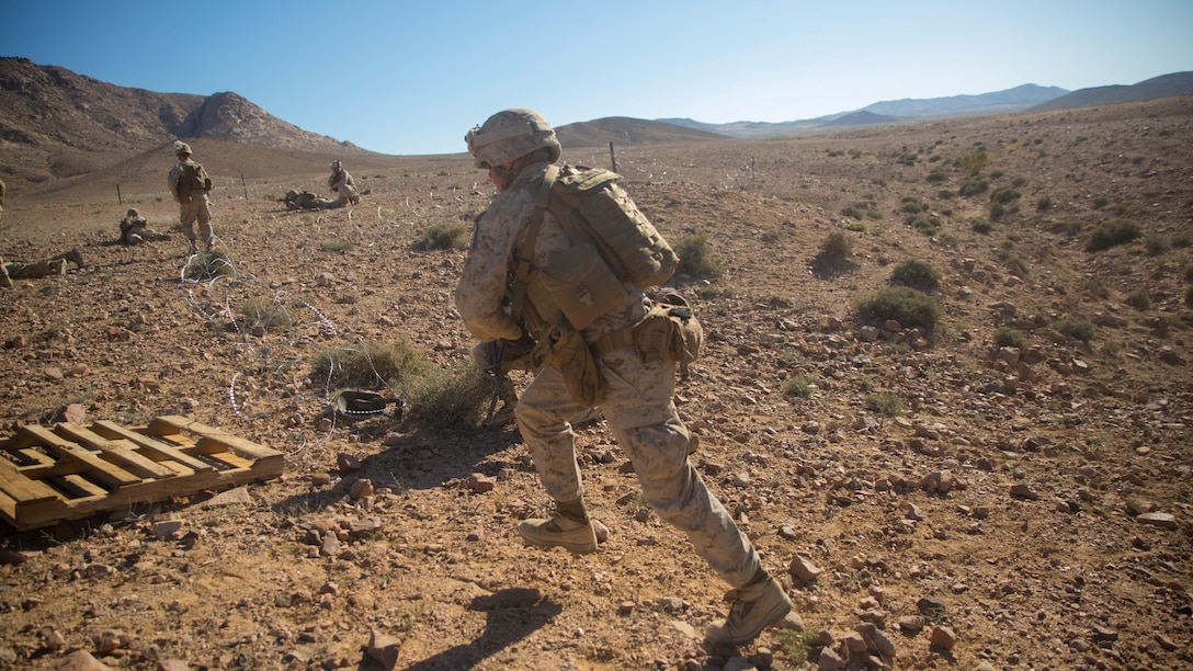 A Marine from Easy Company, 2nd Battalion, 2nd Marine Regiment runs downrange toward his targets during a breaching range May 6, 2015, during exercise Eager Lion 15. Eager Lion is an annual, multinational training exercise designed to build interoperability, promote partnerships and exchange military expertise with 16 partner nations and NATO. Eager Lion 15 takes place in the Hashemite Kingdom of Jordan from May 5-19.