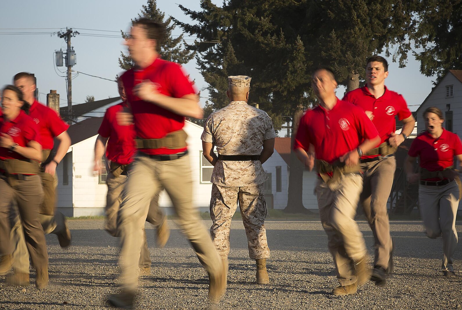 JOINT BASE LEWIS-MCCHORD, Wa. -- Gunnery Sgt. Agustin Juradosegovia, a sergeant instructor from Oxnard, California, observes Marine Corps officer candidates as they prepare to create a formation during Officer Candidates School preparation at Joint Base Lewis-McChord, Washington, May 8, 2015. During the three-day event, Seattle-based sergeant instructors and officer recruiters worked together to physically and mentally prepare candidates for the rigors of OCS, which the candidates will later attend aboard Marine Corps Base Quantico, Virginia. (U.S. Marine Corps photo by Sgt. Reece Lodder)