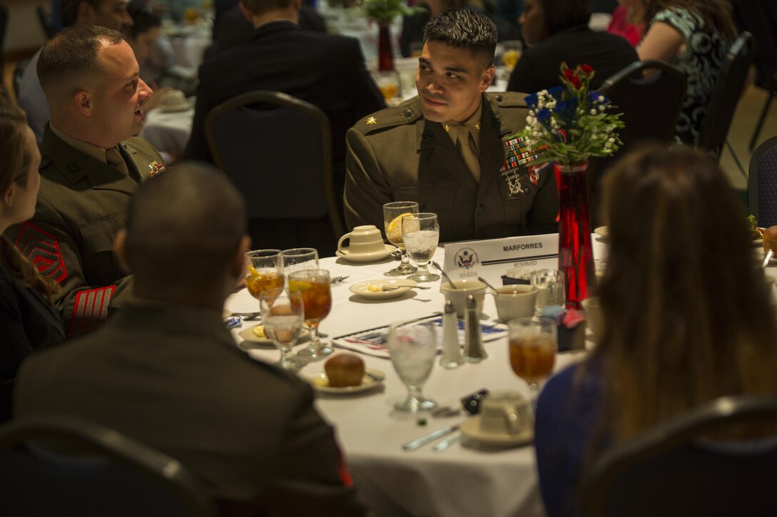 Marines from Marine Forces Reserve eat lunch at the University of New Orleans during a ceremony for Public Service Recognition Week, May 13, 2015.  The ceremony presented military personnel, state and federal government employees with awards that recognized their hard work and dedication to public service. 