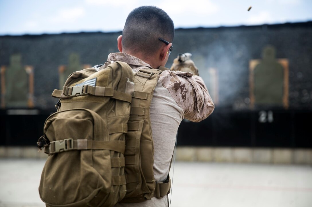 U.S. Marine Sgt. Jesse Riojas engages his target aboard Marine Corps Base Hawaii, May 10, 2015. Riojas is a radio operator with the 15th Marine Expeditionary Unit’s Maritime Raid Force. The MRF is practicing marksmanship skills before continuing with their current deployment with the 15th MEU.  (U.S. Marine Corps photo by Cpl. Anna Albrecht/ Released)