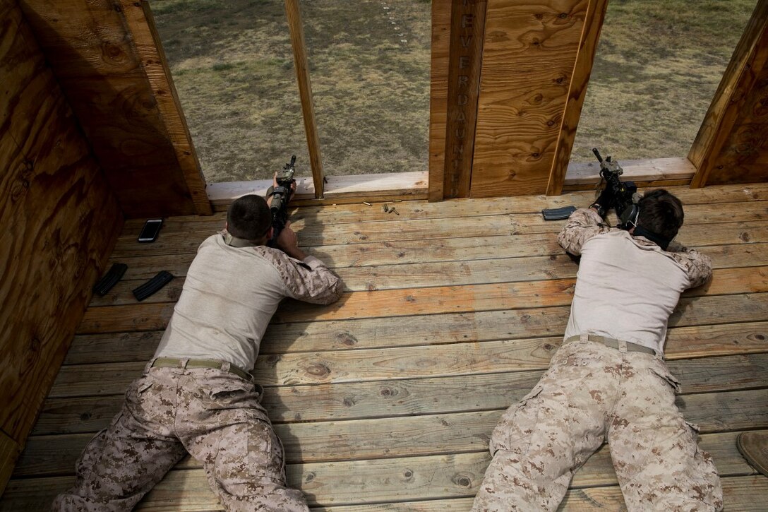 U.S. Marines with the 15th Marine Expeditionary Unit’s Maritime Raid Force aim at their targets aboard Marine Corps Base Hawaii, May 10, 2015. Marksmanship is one of the many essential skills that the MRF must maintain while deployed with the 15th MEU to ensure they are ready for anything. (U.S. Marine Corps photo by Cpl. Anna Albrecht/ Released)