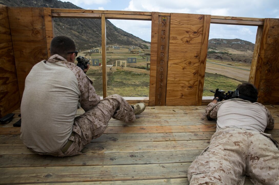 U.S. Marines with the 15th Marine Expeditionary Unit’s Maritime Raid Force sight in on their targets on an unknown distance range aboard Marine Corps Base Hawaii, May 10, 2015. These Marines frequently sustain their marksmanship skills to ensure they are ready for anything they may face on deployment. (U.S. Marine Corps photo by Cpl. Anna Albrecht/ Released)