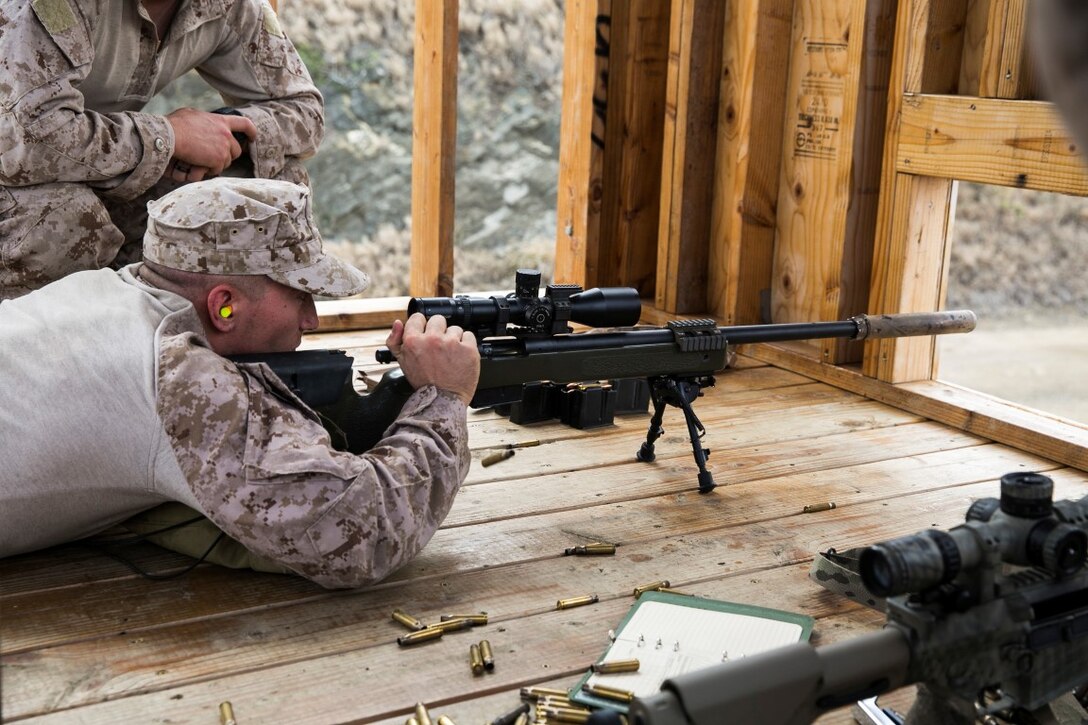 U.S. Marine Cpl. Tyler Beach aims at his target while training on an unknown distance range aboard Marine Corps Base Hawaii, May 10, 2015. Beach is with the 15th Marine Expeditionary Unit’s Maritime Raid Force. Maintaining their marksmanship skills is vital to ensuring that the MRF is capable of executing any of the wide variety of missions they could be tasked with during deployment. (U.S. Marine Corps photo by Cpl. Anna Albrecht/Released)
