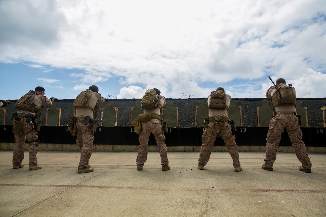 U.S. Marines with the 15th Marine Expeditionary Unit’s Maritime Raid Force fire at targets aboard Marine Corps Base Hawaii, May 10, 2015. The MRF is honing their marksmanship skills to maintain their combat readiness with the 15th MEU on their current deployment in the Pacific.  (U.S. Marine Corps photo by Cpl. Anna Albrecht/ Released)