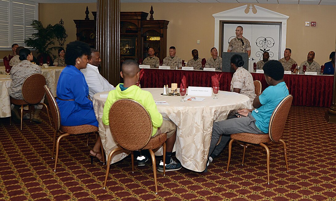 Master Sgt. William Tolleson addresses Marines and local school students during the annual Mentors in Action luncheon held May 14 at Town and Country Restaurant’s Grand Ballroom aboard Marine Corps Logistics Base Albany. The students were the benefactors of more than 260 volunteer hours from Marines through the M.I.A. initiative. 