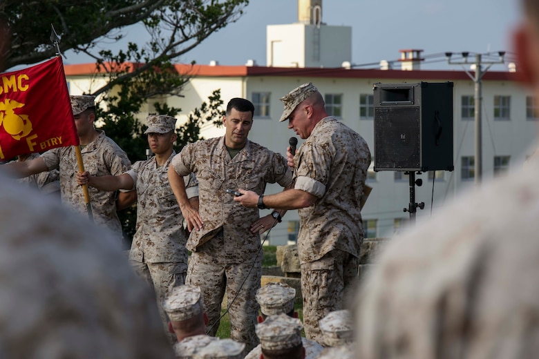 Lt. Col. Mike Wilonsky presents Col. Romin Dasmalchi a plaque during a battalion formation May 8, 2015. Dasmalchi is the commanding officer for the 31st Marine Expeditionary Unit and Wilonsky is the commanding officer for Battalion Landing Team 2/4, 31st MEU. The Marines are with BLT 2/4, 31st MEU, and they recently concluded the annually scheduled Spring Patrol of the Asia-Pacific region. (U.S. Marine Corps photo by Cpl. Ryan C. Mains/ Released)