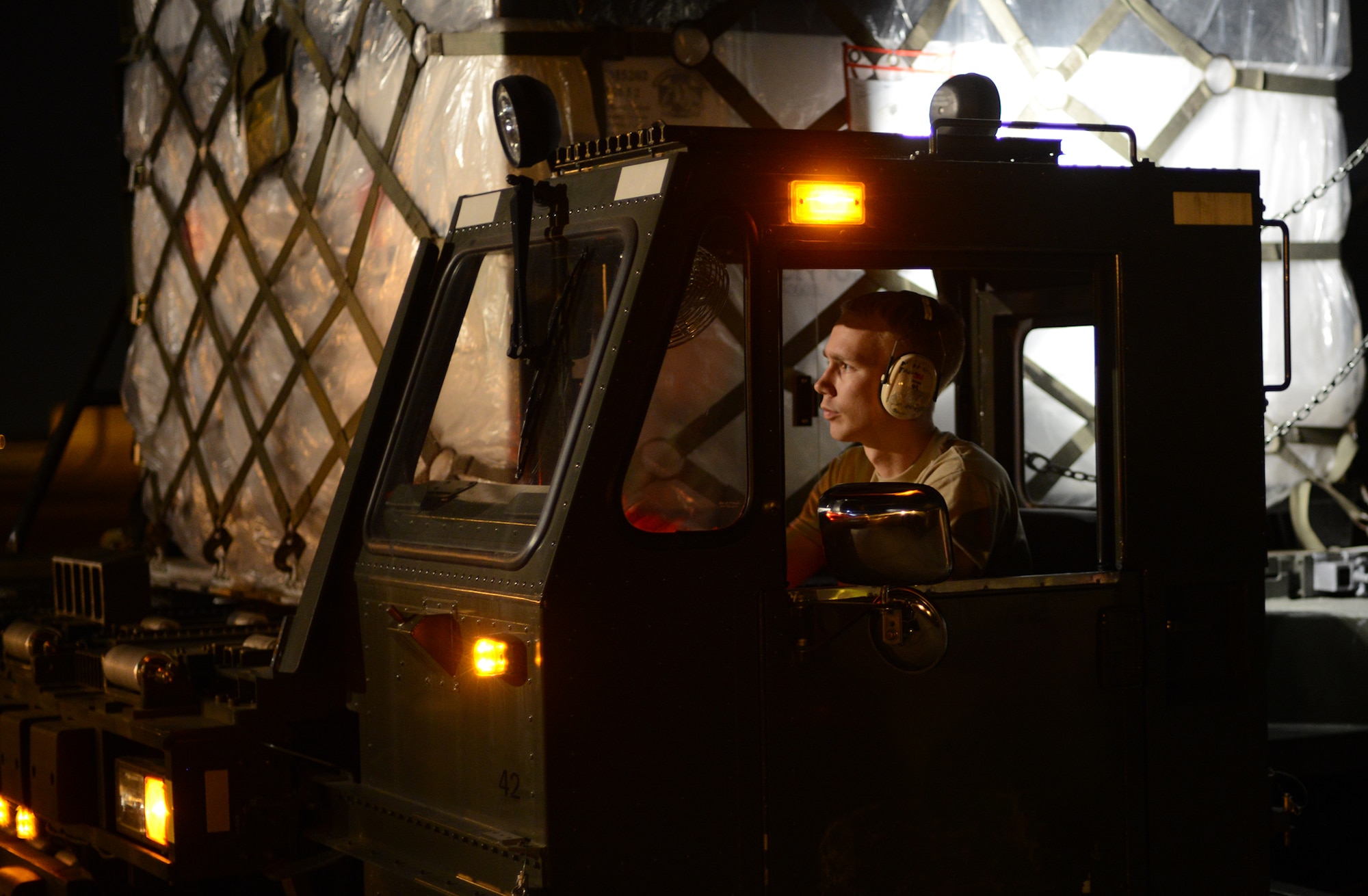 An Airman from the 730th Air Mobility Squadron drives a Halvorsen 60K-loader during a Samurai Readiness Inspection at Yokota Air Base, Japan, May 14, 2015. The readiness inspection was designed to evaluate the wing's ability to perform its mission and respond to regional crisis. (U.S. Air Force photo by Airman 1st Class David C. Danford/Released)