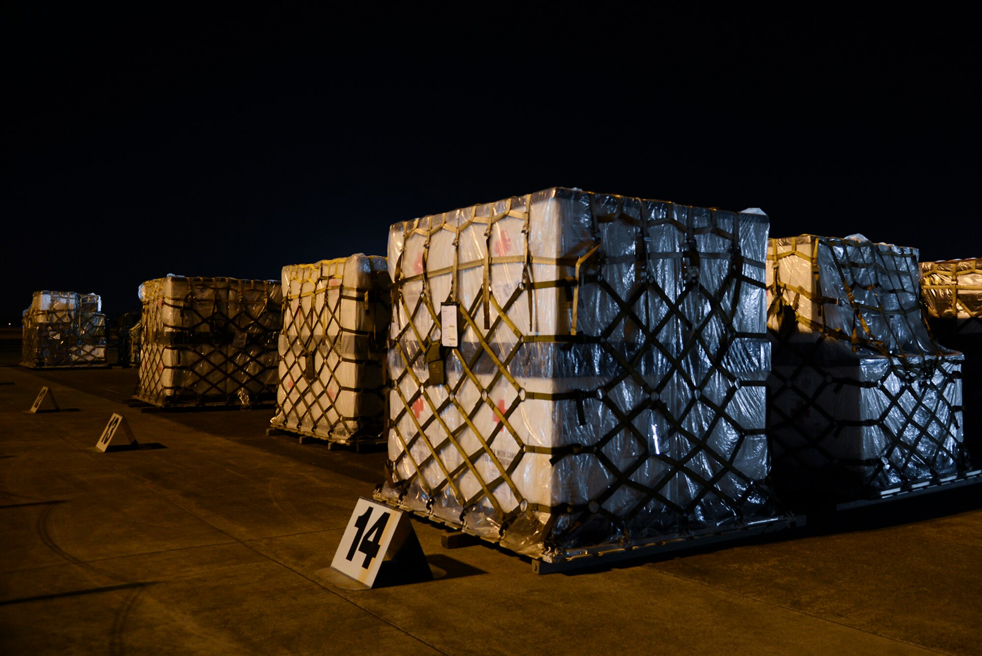 A 60K-loader sits idly before being used to move cargo onto a C-130 Hercules May 14, 2015, at Yokota Air Base, Japan. A C-130 Hercules can carry up to 45,000 pounds in cargo. (U.S. Air Force photo by Senior Airman David Owsianka/Released)