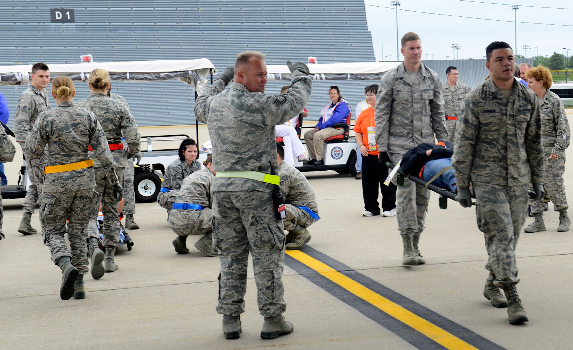 Members of the 22nd Medical Group transport patients onto a C-130 Hercules from the Minnesota Air National Guard, May, 13, 2015, at McConnell Air Force Base, Kan. The 22nd MDG participated in a training exercise, alongside the Robert J. Dole Veterans Affairs Medical Center and representatives from local hospitals. The training prepared the agencies to respond in the event a disaster struck an area and patients had to be transported here for care. (U.S. Air Force photo by Senior Airman Trevor Rhynes)