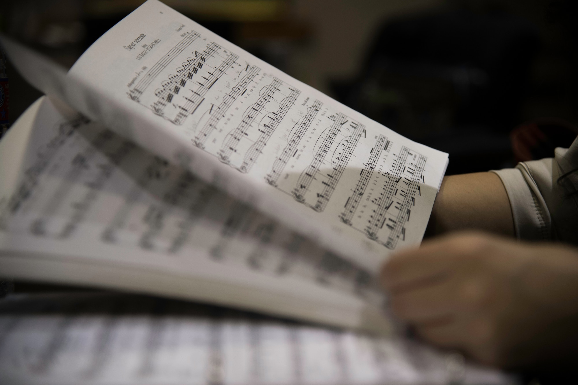Kristen Basore, audition participant, flips through sheet music in Hangar Two as she prepares to audition for a Singing Sergeant soprano position at Joint Base Anacostia-Bolling, D.C., May 5, 2015. Basore also auditioned for the soprano position in the U.S. Air Force Band’s Singing Sergeants four years prior. (U.S. Air Force photo/Airman 1st Class Philip Bryant)